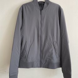 This is a men's bomber jacket from the Banana Republic brand. • Brand: Banana Republic • Style: It features a classic bomber jacket cut. Its character