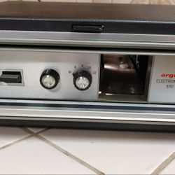 Vintage Slide Projector Argus Electromatic Model 570. The light inside comes on when plugged in but not tested.