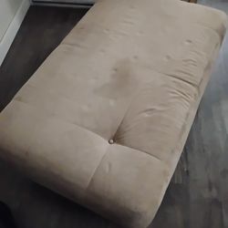 Rarely used Ottoman Tannish, Beige Microfiber Suede With Wooden Legs 
