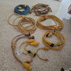 power cords and adapters used to connect boats to dockside electricity