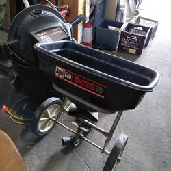 Pull behind spreader