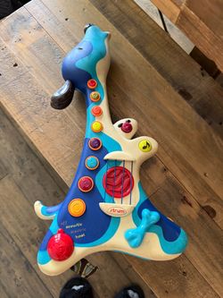 B. Toys Woofer Dog Guitar