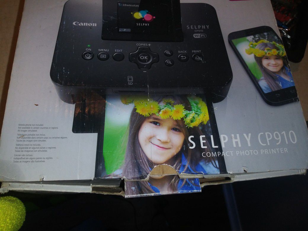 A compact photo printer made by Canon Selphy cp910
