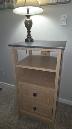 Wooden nightstand / bedside table.