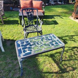 Iron Patio chair $35 and matching coffee table $40 with rose design