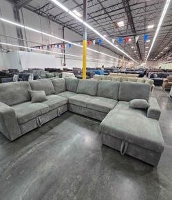 XL sectional sofa with pull-out bed & double storage brand new