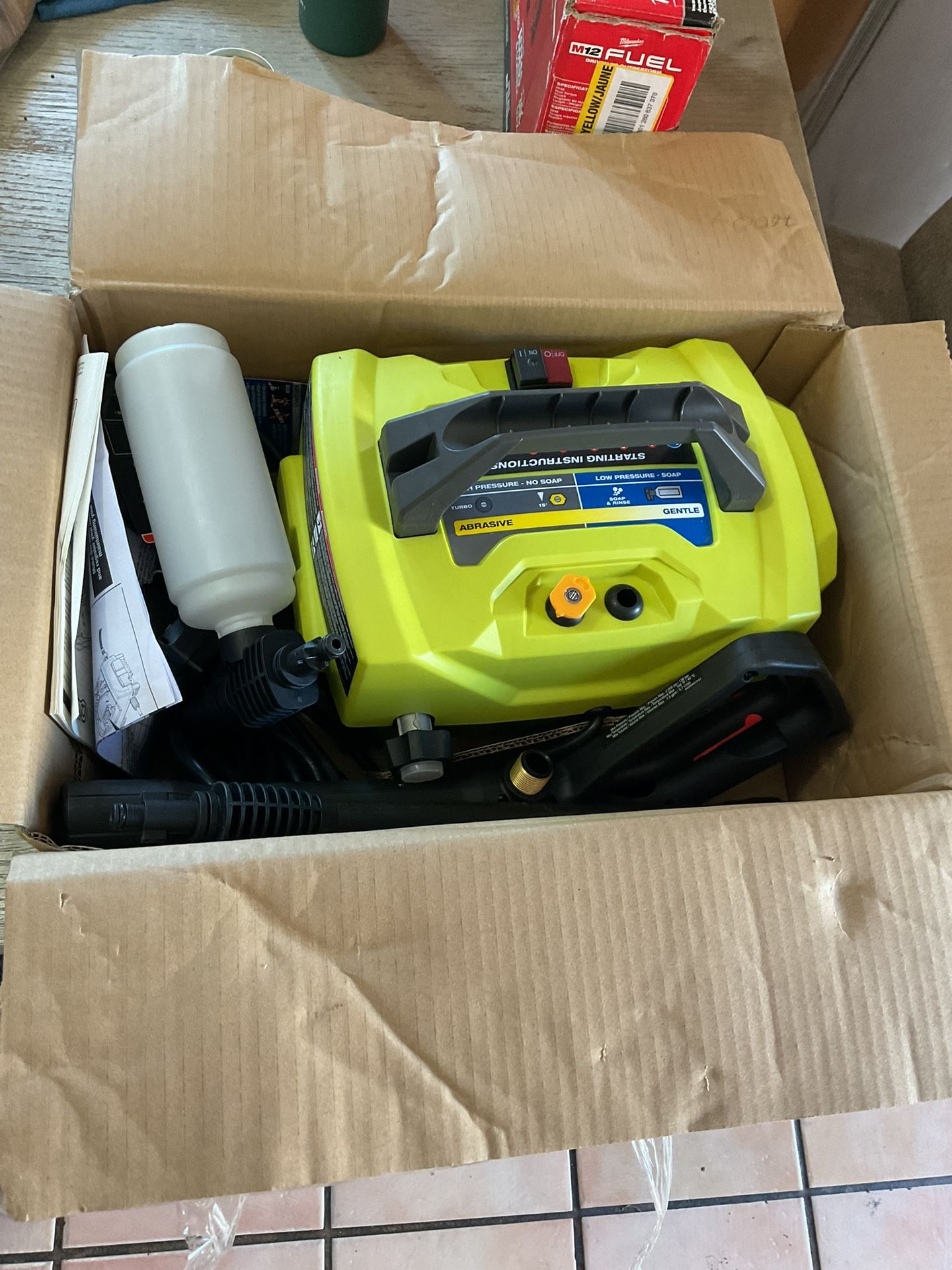 Ryobi 1800 psi electric pressure washer with gun holes and nozzle