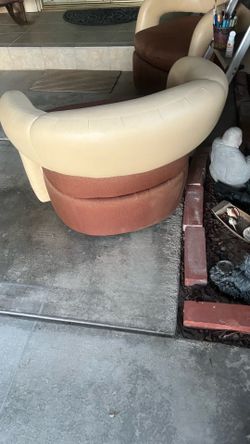 2 barrel chairs that swivel