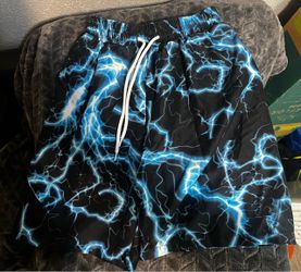 Boys size medium lightning blue quick drying swim shorts