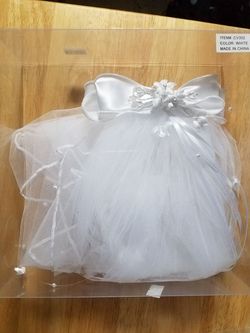 New veils for first communion and flower baskets
