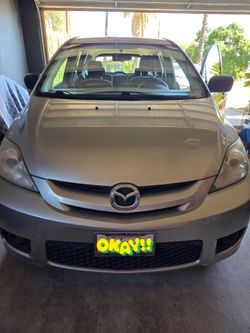 2007 Mazda Mazda5 Sport is a compact, six-passenger mini-minivan featuring sliding rear doors