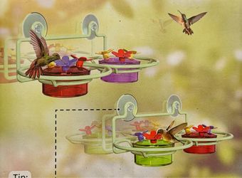 Window hummingbird feeders with a full bottle 64 ounces of electro nectar for hummingbirds