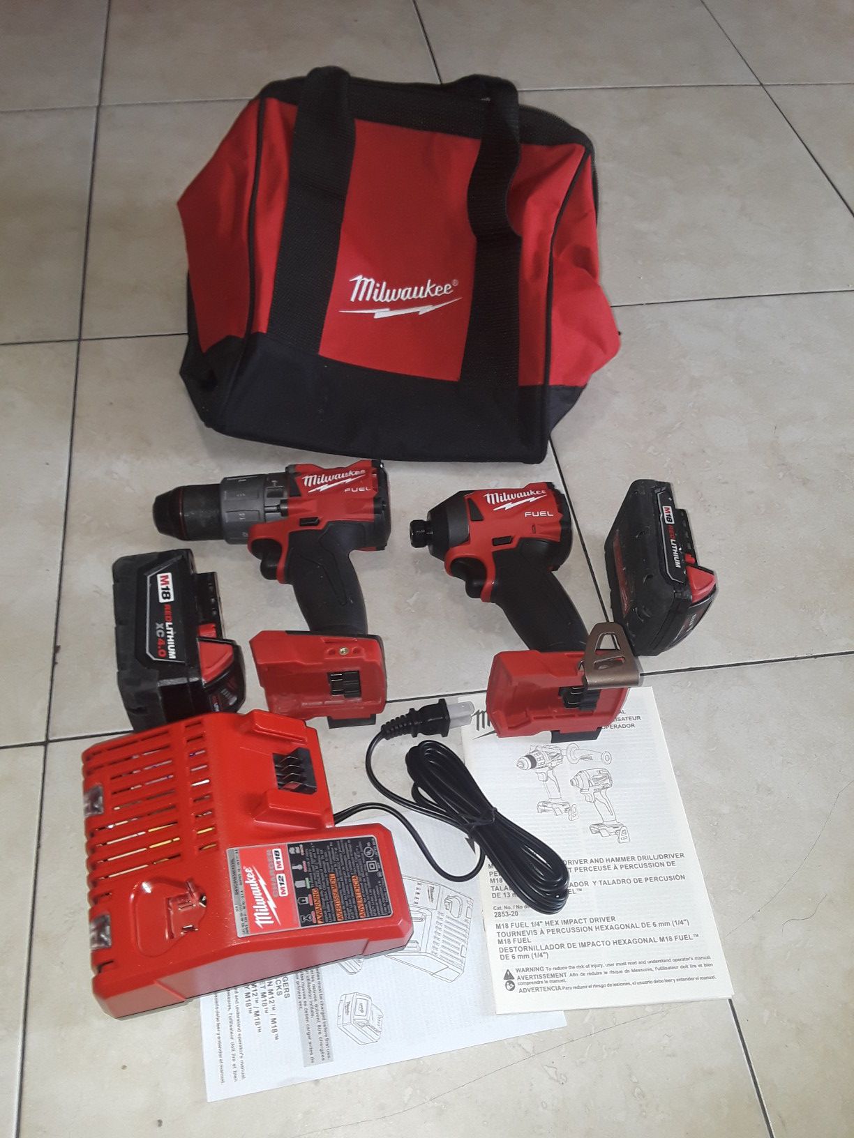 Milwaukee M18 FUEL 18-Volt Lithium-Ion Brushless Cordless Hammer Drill and Impact Driver Combo Kit (2-Tool) with batteries .