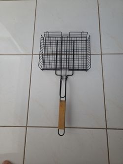 BBQ grill basket set. Large flip style grill basket 12" x 10", total 24 inches long including wooden handle. Includes an extra small grill rack. Non‑s