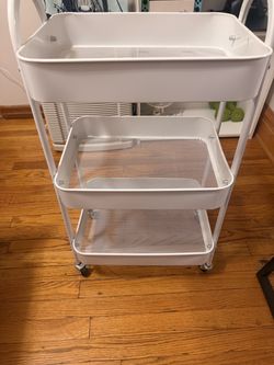 Rolling storage cart shelf