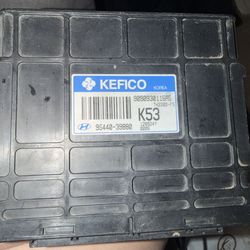 Preowned  950 is a Genuine OEM Automatic Transmission Control Module (TCM) specifically designed for the 2003-2004 Hyundai Tiburon equipped wi