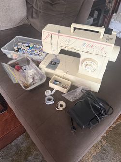 Vintage Singer sewing machine and various threads