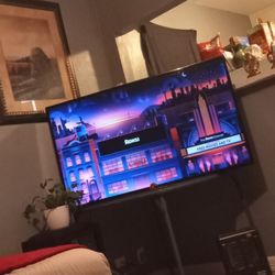 LG TV With Roku HDMI Plugin As Well As Remote 