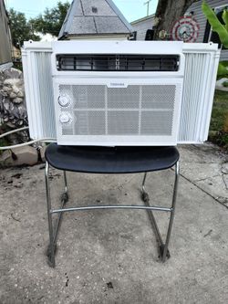 white Toshiba 5,000 BTU window air conditioner