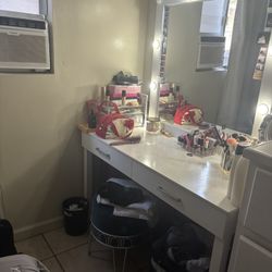 white vanity with light bulbs 