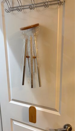 metal wind chime with wooden accents,