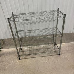 Three tiered metal rack … 36” wide , 14” depth , 36” high .. $45