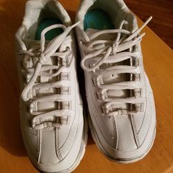 White, preowned Skechers shoes
