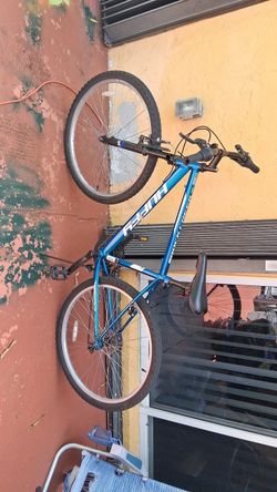 Huffy Blue Felt Mountain Bike and Genesis Green/Black Mountain bike