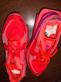 Red and pink Nikes