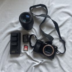 Sony A6000 with 4 batteries and charger 55-210 mm lens, also comes with 256 gb sd card fully wiped and camera bag