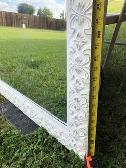 White  Mirror  With Design  Around  It