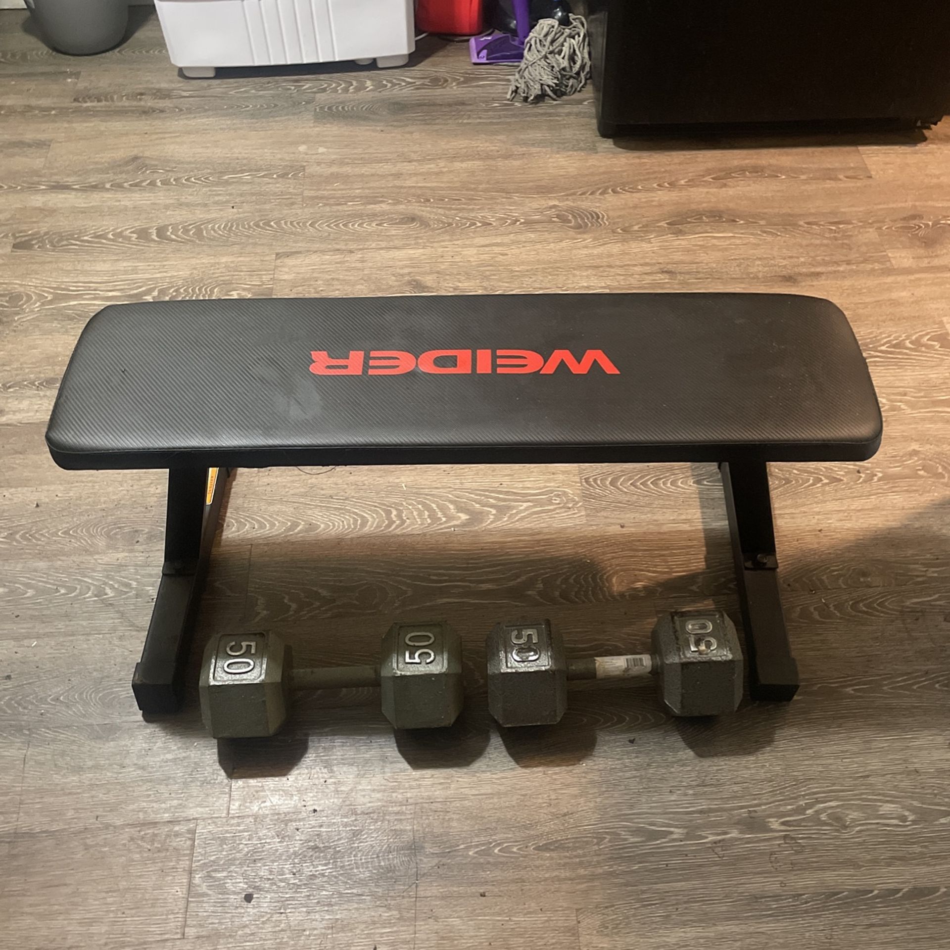 Two 50 Lb Weights And Bench