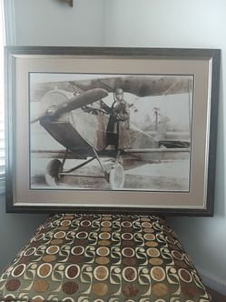 Bessie Coleman Standing On Wheels Of Biplane
