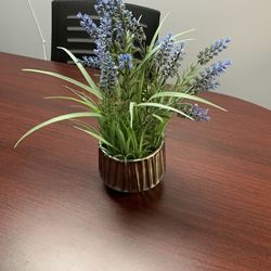 Artificial flowers in a bucket
