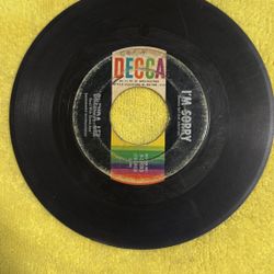This item is a vintage 7-inch vinyl record, specifically a 45 RPM single of Brenda Lee's "I'm Sorry" released by Decca Records. 