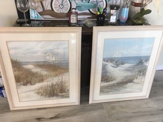 A Pair of Beach pictures by Jacqueline Penny, in glass, frame, and matting. Priced cheaper than frames alone.