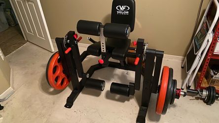 HEAVY DUTY ISOLATED LEG EXTENSION - LEG CURL MACHINE. Weight loaded leg workout machine