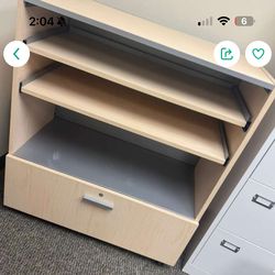 filing cabinet with one drawer and two adjustable shelves.