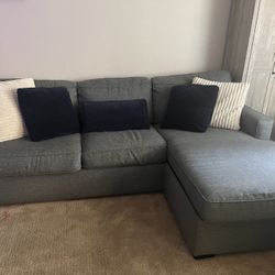 Living Spaces Gray Sectional Sofa With Pullout Bed