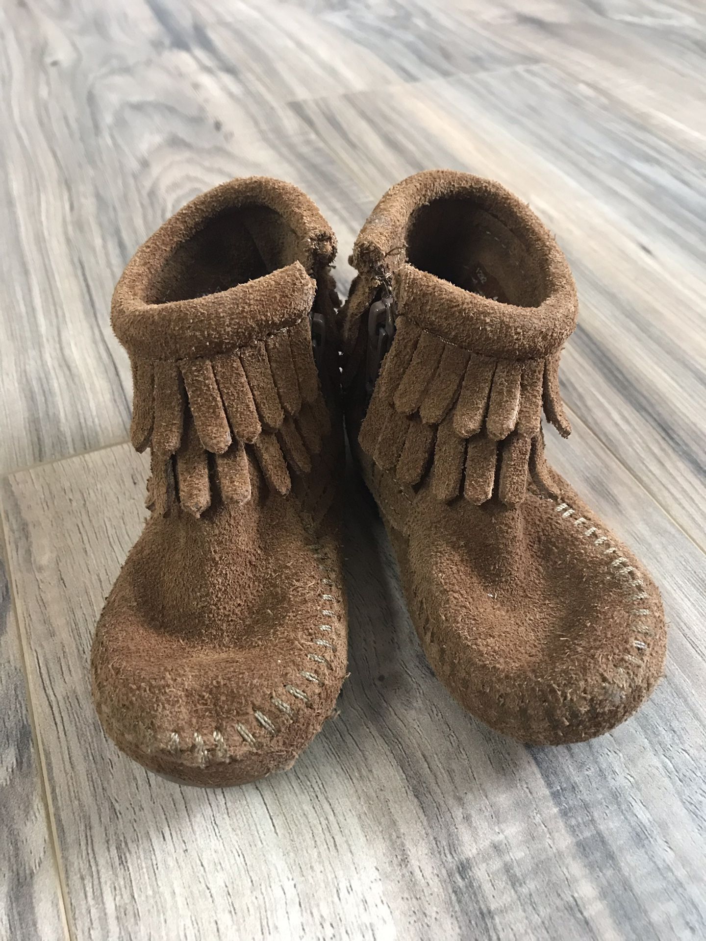 Size 4 Minnetonka brown fringe boots - $12!!
