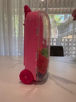 Pink luggage with food
