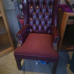 burgundy tufted leather wingback armchair