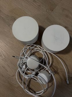 These are Google Wifi mesh routers (first generation)