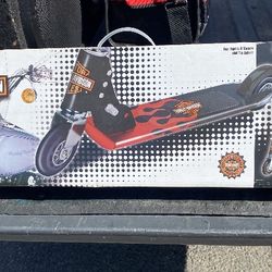 New The product in the image is a Harley-Davidson Ultra Cool Aluminum Scooter, designed for ages 6 and up. Key features include:  Aluminum constructio