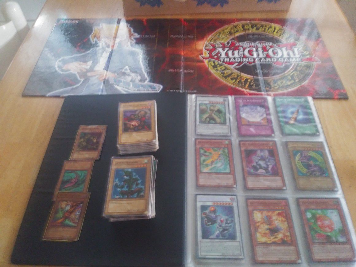 Yugioh game board and cards including a book of hologram cards