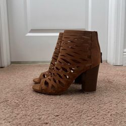 Open toed tan pumps with suede covering in a size women’s 7.5.