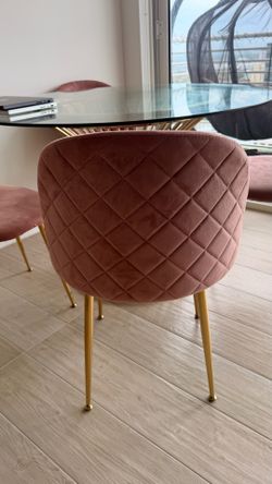 Gold dining Table city furniture with 4 pink chairs