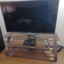 SAMSUNG 55 INCH TV AND  GLASS TV STAND