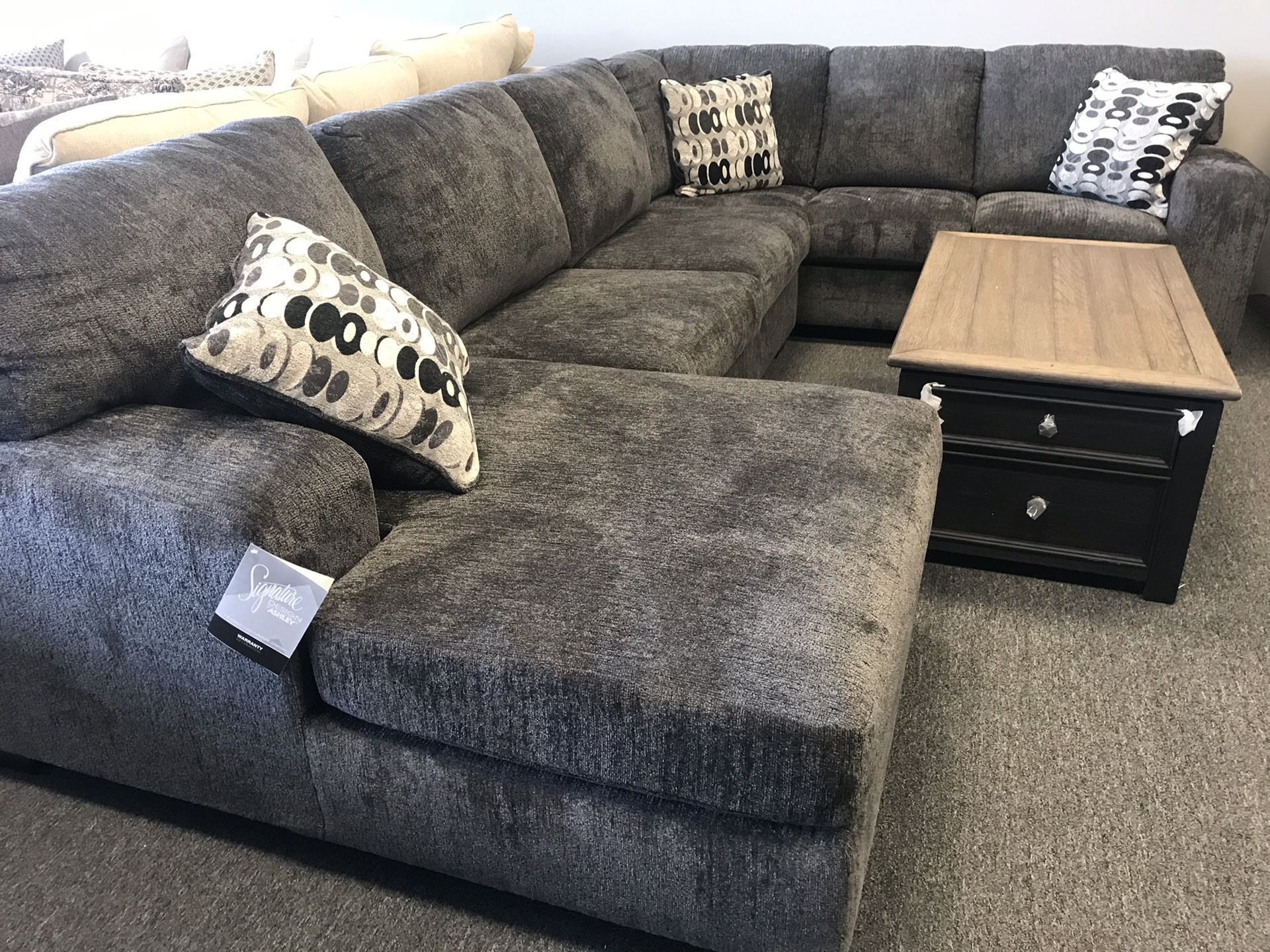 Ashley grey sectional left or right facing chaise available sells for $1999. We have 2 left $59 down takes it or holds on layaway
