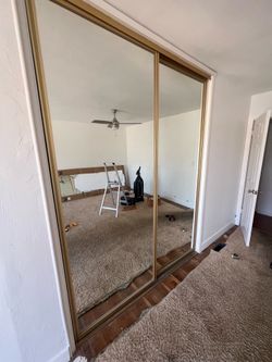 Closet doors with gold trim